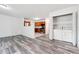 Open-concept living area with kitchen view, modern wood flooring, and convenient washer/dryer access at 3799 Henry Ct, Acworth, GA 30101