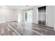 Bright living room with sliding glass door, modern flooring, and neutral tones for versatile styling at 3799 Henry Ct, Acworth, GA 30101