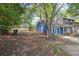 View of the property featuring landscaping, siding, driveway, and side access at 3799 Henry Ct, Acworth, GA 30101