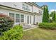 Landscaped backyard with patio, outdoor seating, fire pit, and a well-maintained lawn at 20056 Windalier Way, Roswell, GA 30076