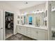 Bright bathroom features double vanity, elegant lighting, and a walk-in closet at 20056 Windalier Way, Roswell, GA 30076