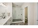 Bright bathroom featuring a glass shower and a neutral color palette at 20056 Windalier Way, Roswell, GA 30076