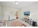 Bright Bedroom with white walls, crib, dresser, rug and toys at 20056 Windalier Way, Roswell, GA 30076