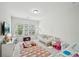Bright Bedroom with crib, soft rug, and lots of natural light from the windows at 20056 Windalier Way, Roswell, GA 30076