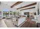 Spacious clubhouse interior featuring a lounge area, bar, and expansive windows overlooking a pool at 20056 Windalier Way, Roswell, GA 30076