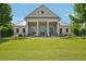 Elegant community clubhouse, Harlow Hall, featuring a covered entry and well-kept landscaping at 20056 Windalier Way, Roswell, GA 30076