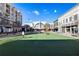 Open green space with benches, walkways, and surrounding commercial buildings, creating a vibrant community area at 20056 Windalier Way, Roswell, GA 30076