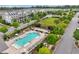Aerial view of community pool with lounge chairs and lush landscaping, perfect for relaxation and recreation at 20056 Windalier Way, Roswell, GA 30076