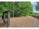 Picturesque dog park with shaded area and a swing, perfect for relaxation and recreation at 20056 Windalier Way, Roswell, GA 30076