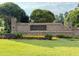 Elegant stone entrance to the community with manicured landscaping at 20056 Windalier Way, Roswell, GA 30076