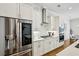 Well-appointed kitchen with stainless steel refrigerator, gas range, and ample cabinet space for storage at 20056 Windalier Way, Roswell, GA 30076