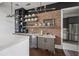Kitchenette with open shelving, stainless steel appliances and a brick accent wall at 20056 Windalier Way, Roswell, GA 30076