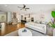 Inviting living room boasts hardwood floors, neutral tones, and an open layout connecting to the kitchen at 20056 Windalier Way, Roswell, GA 30076