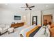 Bright main bedroom featuring carpet, a television, and access to an en-suite at 20056 Windalier Way, Roswell, GA 30076
