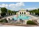 Beautiful community pool area with lounge chairs and umbrellas for relaxing by the water at 20056 Windalier Way, Roswell, GA 30076