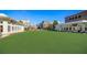Well-maintained green in town square offers a relaxing place to unwind at 20056 Windalier Way, Roswell, GA 30076