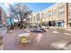 Charming town square with a water fountain, outdoor seating, and shops, creating a welcoming atmosphere at 20056 Windalier Way, Roswell, GA 30076