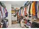 Spacious walk-in closet with custom shelving and ample storage for clothes and accessories at 20056 Windalier Way, Roswell, GA 30076