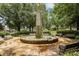 Picturesque water fountain surrounded by lush greenery and benches, creating a serene and inviting park setting at 20056 Windalier Way, Roswell, GA 30076