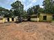 Backyard view with detached shed and pile of rubble at 3700 Moore Rd, Austell, GA 30106