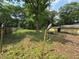 View of the backyard surrounded by wooden fence and trees at 3700 Moore Rd, Austell, GA 30106