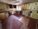 Damaged kitchen with tile floor, older cabinets, and window in need of total renovation at 3700 Moore Rd, Austell, GA 30106