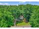 Aerial view of the home surrounded by lush green trees in a neighborhood at 5341 Tall Oak Dr, Marietta, GA 30068