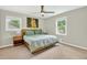 Calm bedroom with a ceiling fan, windows, and a painting on the wall at 5341 Tall Oak Dr, Marietta, GA 30068