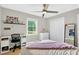 Cozy bedroom featuring a plush bed, desk, and closet at 5341 Tall Oak Dr, Marietta, GA 30068