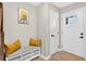 Welcoming entryway featuring a bench with storage and a modern door with a window, creating a stylish first impression at 5341 Tall Oak Dr, Marietta, GA 30068