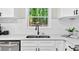 A modern kitchen sink with sleek fixtures and a bright window offers an efficient and stylish workspace at 5341 Tall Oak Dr, Marietta, GA 30068