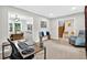 Bright living room showcasing neutral paint, carpeted floors, and comfortable seating area at 5341 Tall Oak Dr, Marietta, GA 30068