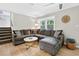 Comfortable living room with large sectional sofa, stylish decor, and hardwood floors at 5341 Tall Oak Dr, Marietta, GA 30068