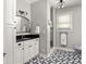 Bathroom features a black and white patterned floor and a glass-enclosed shower at 608 Hardendorf Ne Ave, Atlanta, GA 30307
