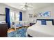 Spacious bedroom has two white cribs, a queen bed, wood floors, and bright blue accents at 608 Hardendorf Ne Ave, Atlanta, GA 30307