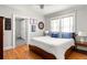 Comfortable bedroom with a ceiling fan, wood floors, and natural light from large windows at 608 Hardendorf Ne Ave, Atlanta, GA 30307