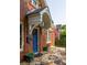 The brick home has a covered front entry with a charming stone tile porch at 608 Hardendorf Ne Ave, Atlanta, GA 30307
