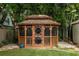 Charming backyard gazebo featuring a rustic wooden design surrounded by lush greenery at 608 Hardendorf Ne Ave, Atlanta, GA 30307