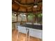Inside view of the gazebo highlighting an overhead fan and seating around a table at 608 Hardendorf Ne Ave, Atlanta, GA 30307