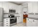 Bright kitchen featuring stainless steel appliances and white cabinetry at 608 Hardendorf Ne Ave, Atlanta, GA 30307