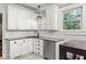 Bright kitchen featuring stainless steel appliances, white cabinetry and modern countertops at 608 Hardendorf Ne Ave, Atlanta, GA 30307