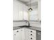 Bright kitchen features white cabinetry, subway tile backsplash, and stainless steel appliances at 608 Hardendorf Ne Ave, Atlanta, GA 30307