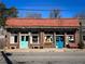 Charming storefront with vibrant blue and green doors, red tile roof, and inviting curb appeal at 608 Hardendorf Ne Ave, Atlanta, GA 30307