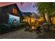 Backyard with outdoor cinema, fire pit seating, and ambient lighting at 907 Eden Se Ave, Atlanta, GA 30316