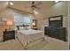 Carpeted bedroom with neutral walls, a ceiling fan, and dark wood furniture at 907 Eden Se Ave, Atlanta, GA 30316