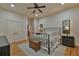 Comfortable bedroom with ceiling fan, neutral paint, lots of natural light, and hardwood flooring at 907 Eden Se Ave, Atlanta, GA 30316