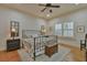 Relaxing bedroom with ceiling fan, neutral paint, lots of natural light, and hardwood flooring at 907 Eden Se Ave, Atlanta, GA 30316