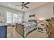 Comfortable bedroom featuring natural light, carpeted floor, and a ceiling fan at 907 Eden Se Ave, Atlanta, GA 30316