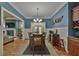 Spacious dining room featuring wainscotting, stylish decor, and seamless access to the kitchen and living room at 907 Eden Se Ave, Atlanta, GA 30316