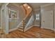 Elegant foyer featuring hardwood floors, staircase with rod iron railing, and decorative details at 907 Eden Se Ave, Atlanta, GA 30316